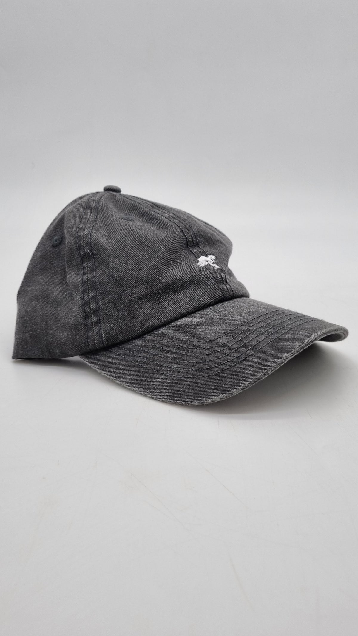 A grey colored cap with a logo on the front.