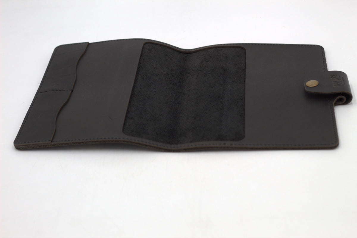 Black leather journal cover opened to reveal a suede finish