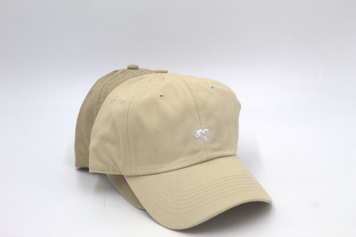 A beige colored cap with a logo on the front.