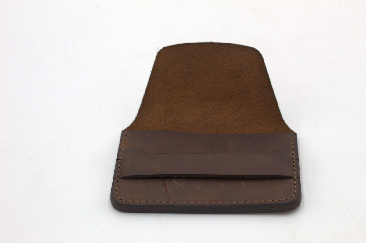 A brown leather wallet with multiple card slots visible.