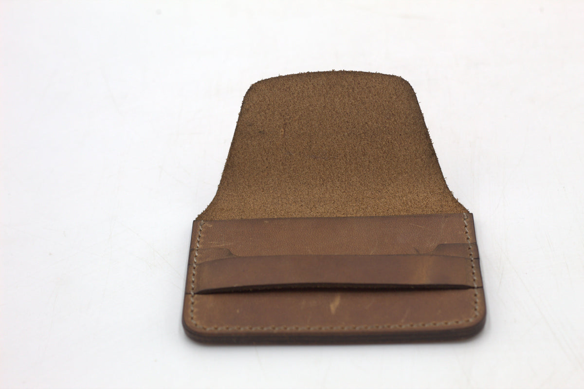 A brown leather wallet with multiple card slots visible.