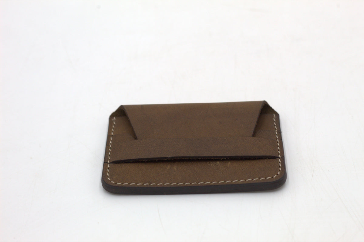 A brown leather wallet with multiple card slots visible.