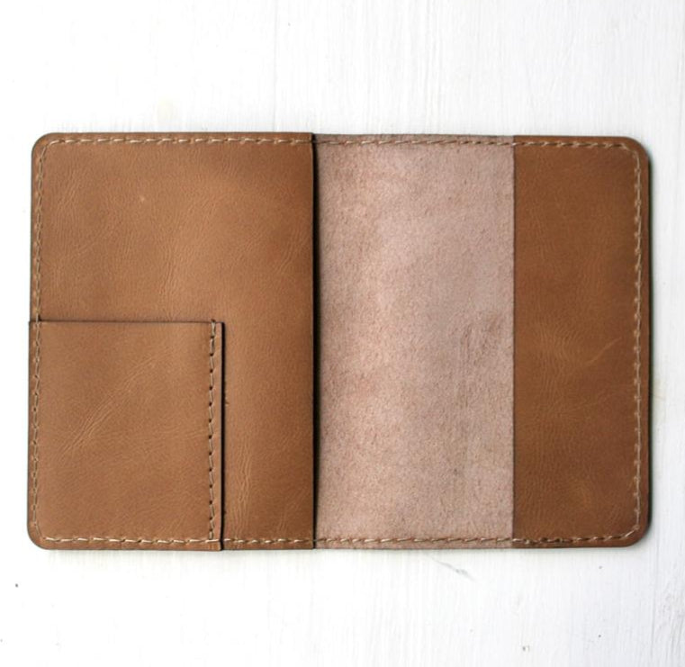 Brown leather wallet on a white background