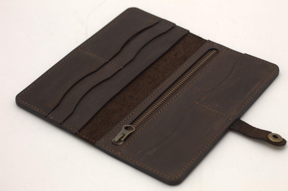 Black leather wallet opened to reveal card slots and coin pouch
