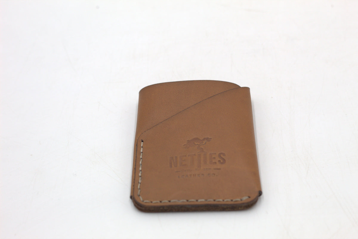 Brown leather coin purse on a white background