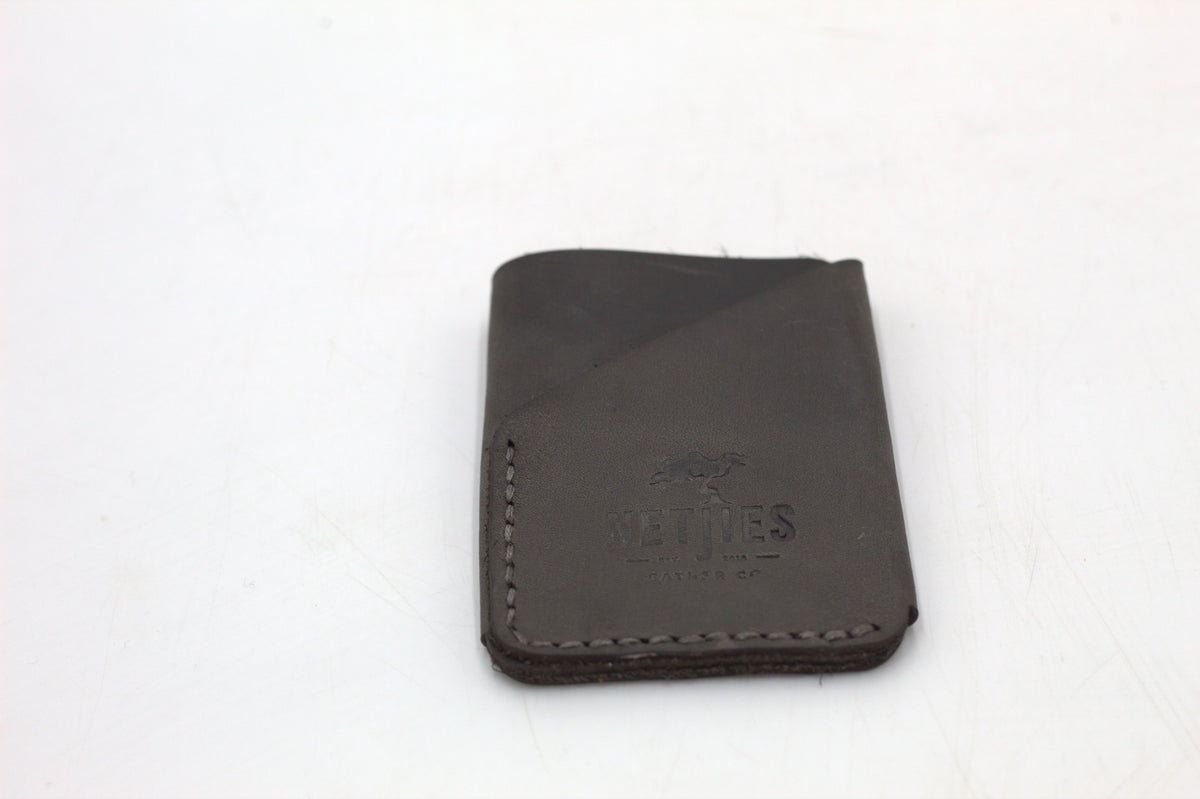 Black leather coin purse on a white background