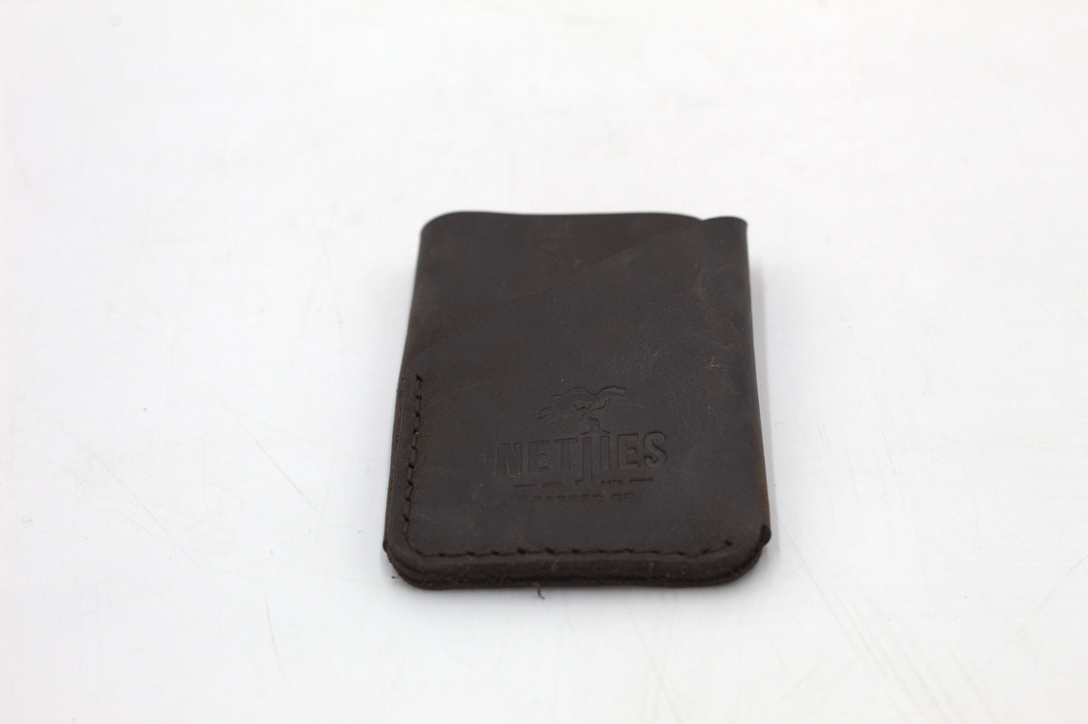 Brown leather coin purse on a white background