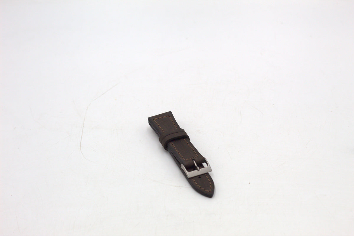 Three leather watch straps in brown, black, and green colors, displayed on a white background.