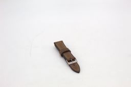 Three leather watch straps in brown, black, and green colors, displayed on a white background.