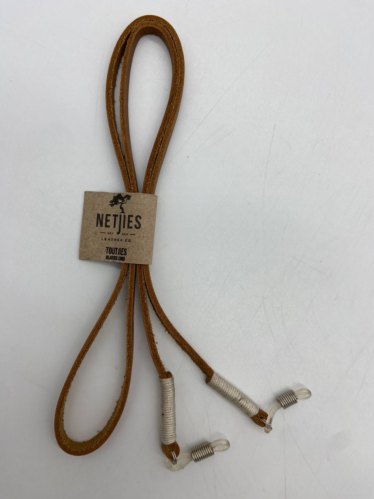 Brown lanyard with metal clips on a white background, featuring a 'Netjies' label.