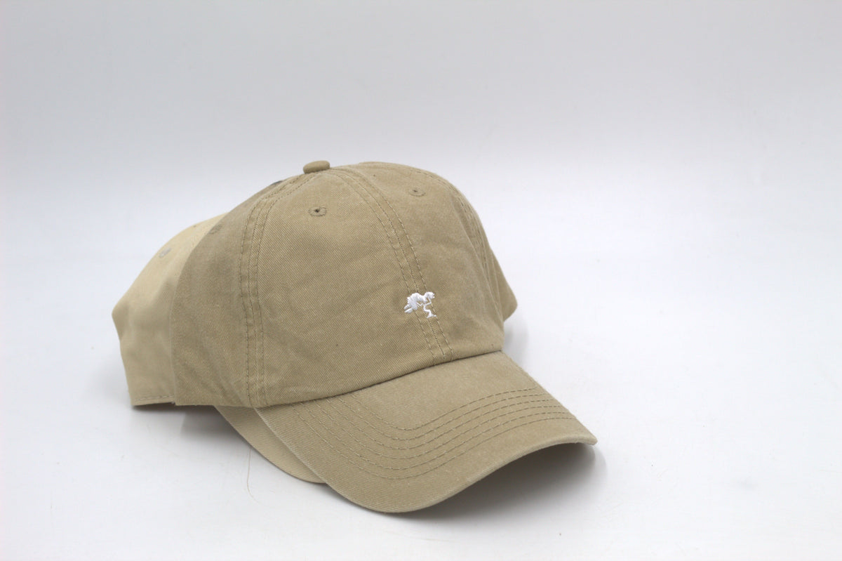 A beige colored cap with a logo on the front.