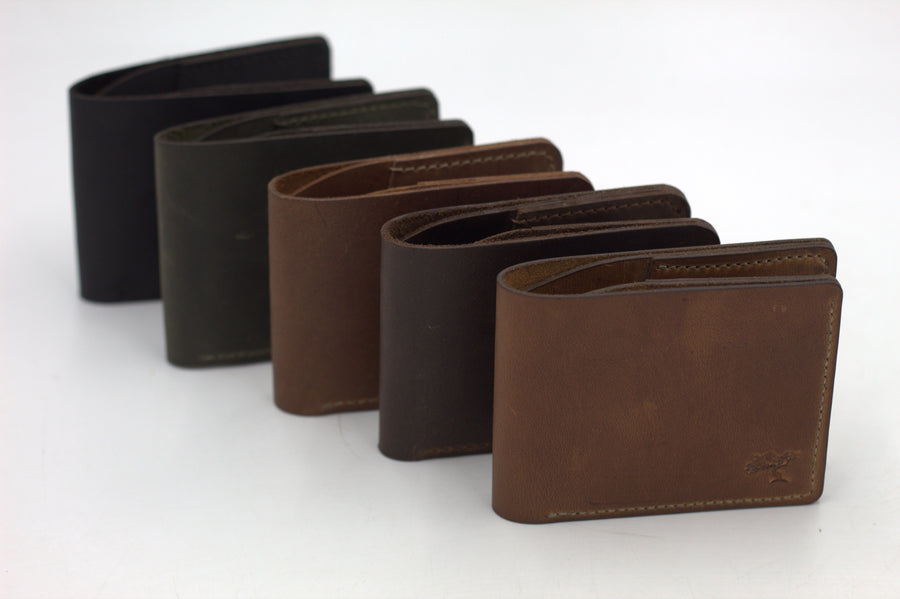 A collection of netjies leather wallets in various colors displayed side by side.
