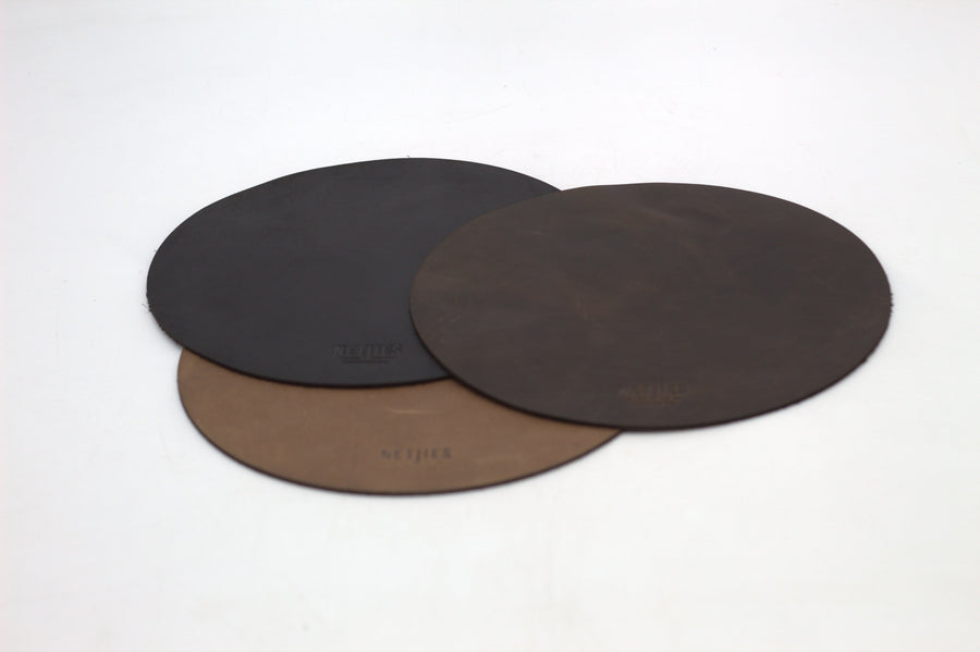 Three medium round mousepads in black, brown, and dark brown colors, displayed on a white background.