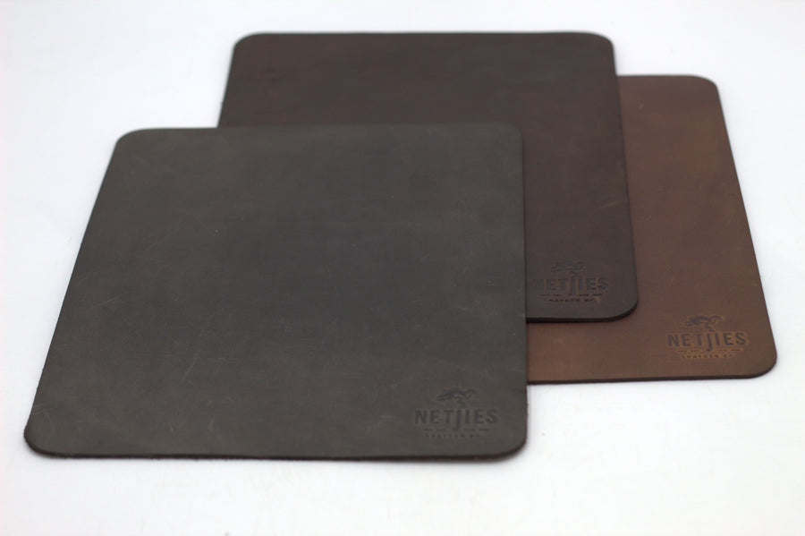 Three large rectangle mousepads in black, brown, and gray colors, with a brand logo imprinted on the brown mousepad.