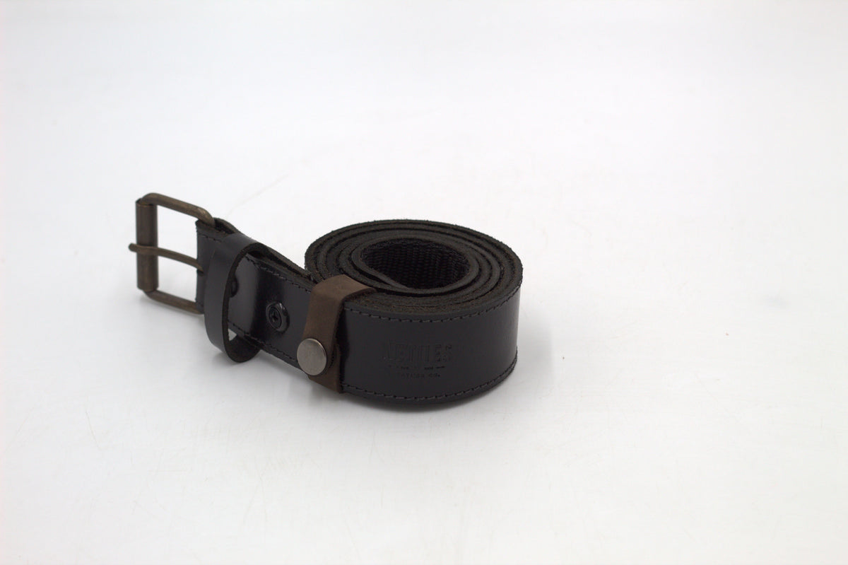 A black leather belt with a metal buckle, placed against a white background.
